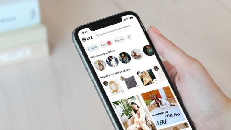 A hand holds a smartphone displaying the LTK shopping app, showing influencer profiles, recently viewed products, and product images.