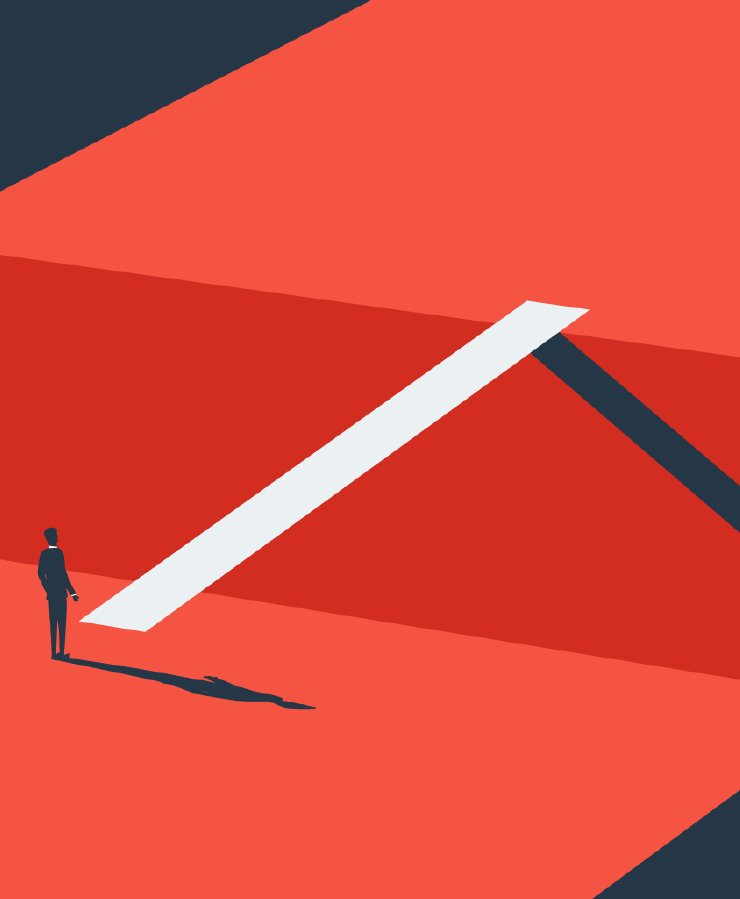 A man standing in front of a bridge.