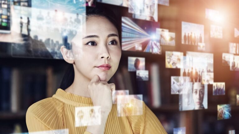 A woman in a yellow top looks thoughtfully at floating digital screens displaying various images and data, suggesting analysis or contemplation of information.
